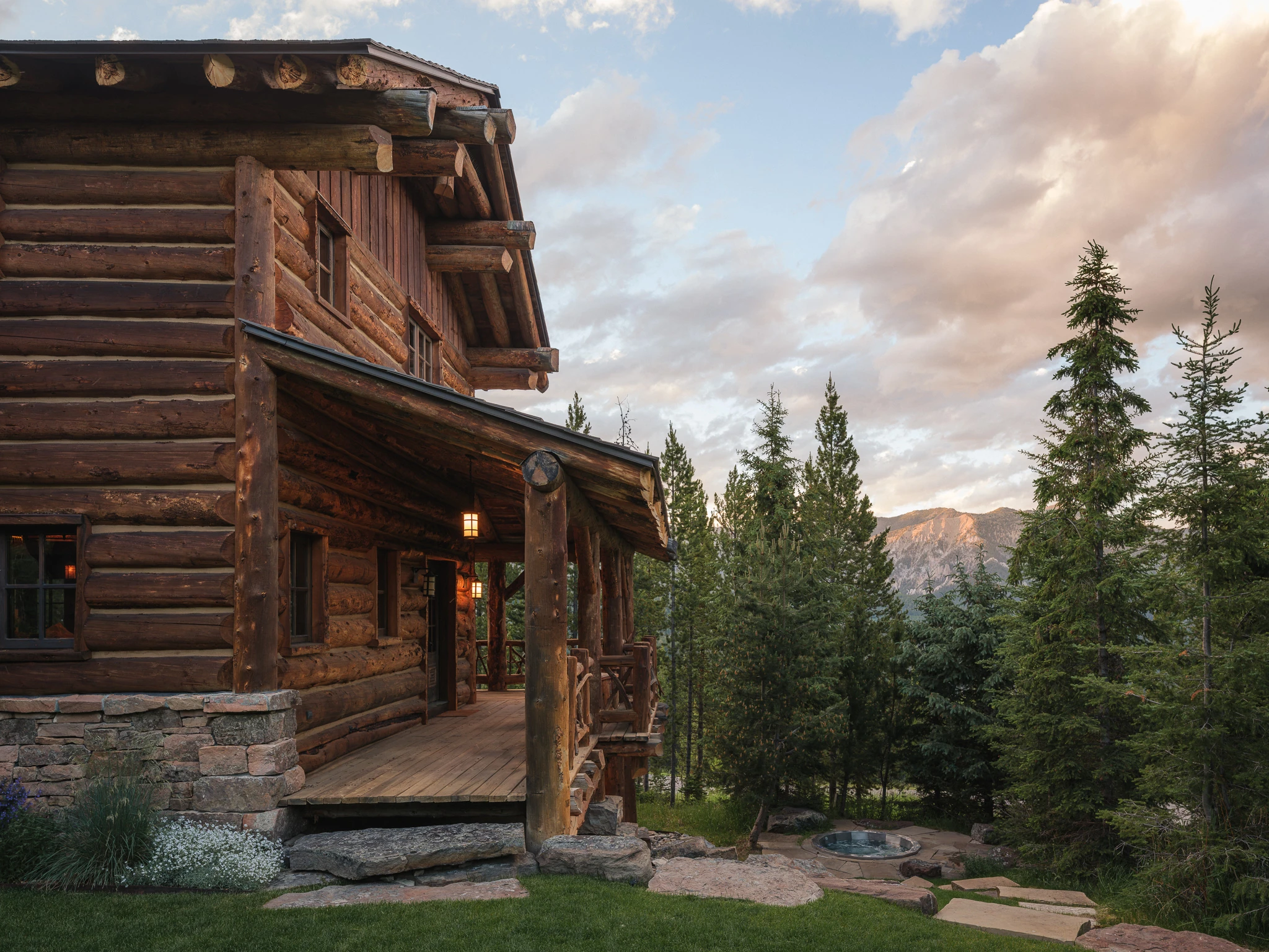 Exterior porch and hot tub at dusk — architectural photography Big Sky Montana, Club Ridge